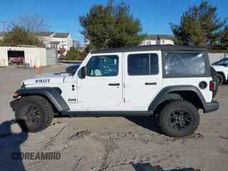 2021 Jeep Wrangler Unlimited Sport S with VIN 1C4HJXDG5MW697149, listed as a IAAI auction lot 41642386 with 71,253 mi miles. Bid and sale history available at carsss.com. Image 14.