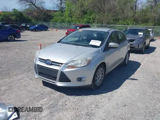 2012 Ford Focus SE with VIN 1FAHP3K27CL333433, listed as a IAAI auction lot 42140452 with 156,048 mi miles and . Bid and sale history available at carsss.com. Image 2.
