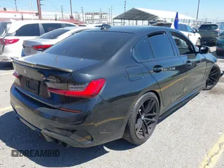 2020 BMW 3 Series M340i with VIN WBA5U7C04LFH33037, listed as a IAAI auction lot 41872419 with 68,065 mi miles. Bid and sale history available at carsss.com. Image 4.