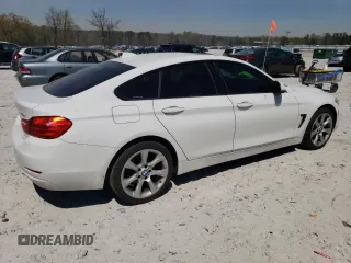 2015 BMW 4 Series 428i xDrive with VIN WBA4A7C50FD415218, listed as a Copart auction lot 50745555 with 139,343 mi miles and Salvage title. Bid and sale history available at DreamBid. Image 3.