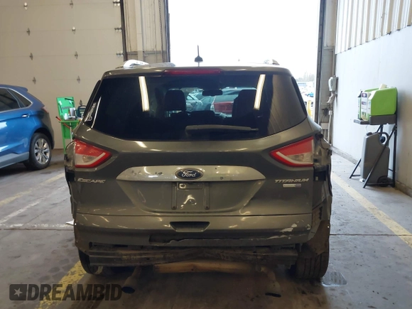 2016 Ford Escape Titanium with VIN 1FMCU9J92GUB63525, listed as a IAAI auction lot 41469824 with 156,773 mi miles. Bid and sale history available at carsss.com. Image 16.
