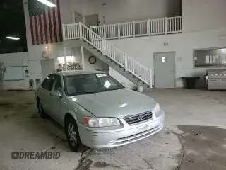 2001 Toyota Camry LE z VIN 4T1BF28K21U963819, wystawiony jako Copart lot #54551465 z przebiegiem 199 472 mil mil oraz Szkoda całkowita • Salvage title. Historia ofert i sprzedaży dostępna na DreamBid. Obrazek 13.