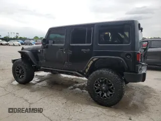 2014 Jeep Wrangler Unlimited Rubicon X with VIN 1C4HJWFG0EL142071, listed as a Copart auction lot 56187575 with 110,597 mi miles and Salvage title. Bid and sale history available at DreamBid. Image 2.