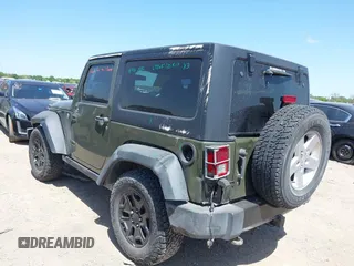 2015 Jeep Wrangler Sport with VIN 1C4AJWAGXFL650428, listed as a IAAI auction lot 42010629 with 80,039 mi miles. Bid and sale history available at carsss.com. Image 3.