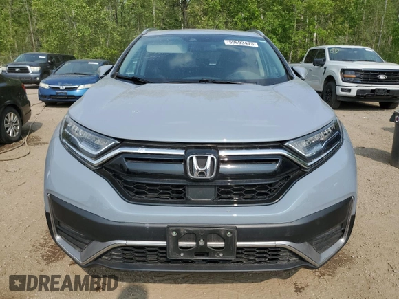 2020 Honda CR-V Touring z VIN 2HKRW2H9XLH236764, wystawiony jako Copart lot #59693475 z przebiegiem Nie podano mil oraz Czysty tytuł • Clean title. Historia ofert i sprzedaży dostępna na DreamBid. Obrazek 5.