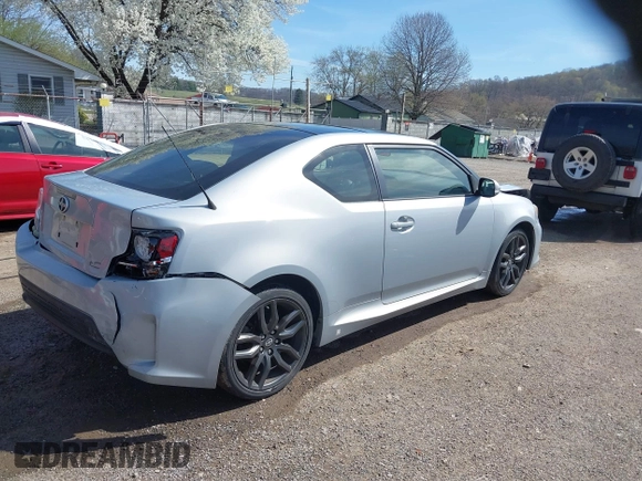 2014 Scion tC with VIN JTKJF5C70E3068144, listed as a IAAI auction lot 41983751 with 137,894 mi miles. Bid and sale history available at carsss.com. Image 4.