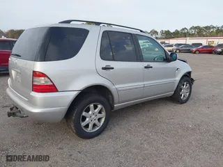 1999 Mercedes-Benz M-Class with VIN 4JGAB72EXXA131890, listed as a IAAI auction lot 41721001 with 168,969 mi miles. Bid and sale history available at carsss.com. Image 4.