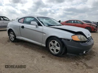 2003 Hyundai Tiburon z VIN KMHHM65D43U017995, wystawiony jako Copart lot #56498665 z przebiegiem 162 820 mil mil oraz Szkoda całkowita • Salvage title. Historia ofert i sprzedaży dostępna na DreamBid. Obrazek 4.