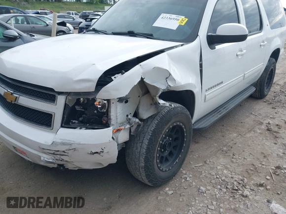 2013 Chevrolet Suburban LT with VIN 1GNSCJE05DR147101, listed as a IAAI auction lot 42336950 with 147,429 mi miles and . Bid and sale history available at DreamBid. Image 6.
