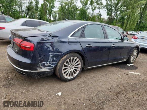 2015 Audi A8 4.0T with VIN WAUJ2AFD6FN011009, listed as a Copart auction lot 64173005 with 153,377 mi miles and Salvage title. Bid and sale history available at DreamBid. Image 3.