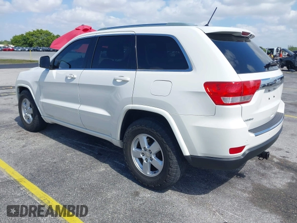 2011 Jeep Grand Cherokee Laredo with VIN 1J4RS4GG0BC573388, listed as a IAAI auction lot 42167064 with 63,363 mi miles and . Bid and sale history available at DreamBid. Image 3.