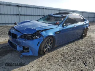 2015 BMW M5 with VIN WBSFV9C5XFD594243, listed as a Copart auction lot 84737024 with 82,150 mi miles and Salvage Title. Bid and sale history available at carsss.com. Image 1.