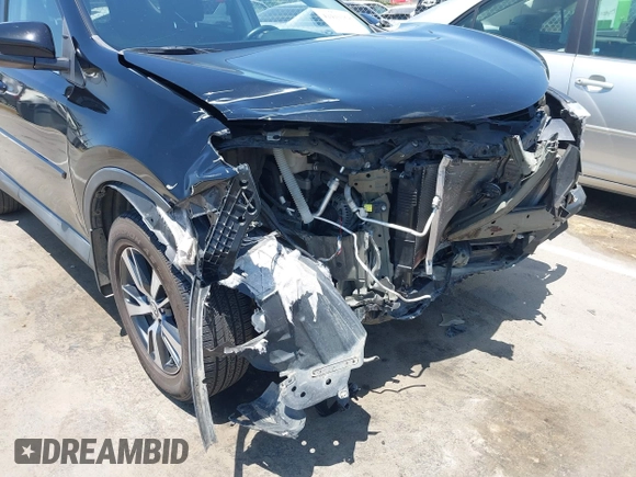 2018 Toyota RAV4 XLE with VIN 2T3WFREV2JW447623, listed as a IAAI auction lot 42410168 with 84,800 mi miles and . Bid and sale history available at DreamBid. Image 18.