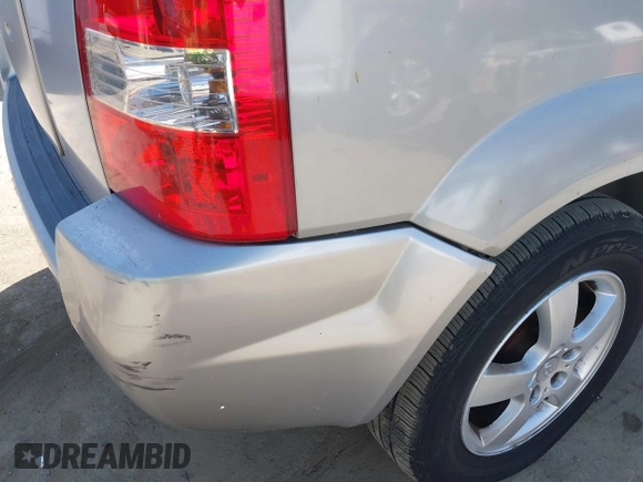 2005 Hyundai Tucson GL with VIN KM8JM12B95U097899, listed as a IAAI auction lot 41953290 with 111,090 mi miles. Bid and sale history available at carsss.com. Image 6.