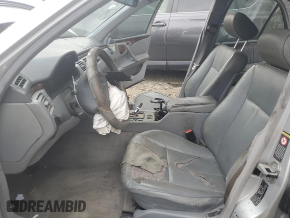 2001 Mercedes-Benz E-Class with VIN WDBJF65J71B201020, listed as a Copart auction lot 76067154 with 328,629 mi miles and Salvage Title. Bid and sale history available at carsss.com. Image 7.