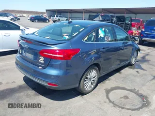 2018 Ford Focus Titanium with VIN 1FADP3J21JL323767, listed as a IAAI auction lot 42375218 with 104,440 mi miles and . Bid and sale history available at DreamBid. Image 4.