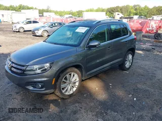 2013 Volkswagen Tiguan S with VIN WVGAV3AX7DW624136, listed as a IAAI auction lot 42256657 with 124,000 mi miles and . Bid and sale history available at DreamBid. Image 2.