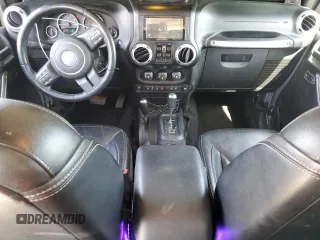 2014 Jeep Wrangler Unlimited Sahara with VIN 1C4HJWEG1EL126611, listed as a Copart auction lot 57169485 with 122,000 mi miles and Salvage title. Bid and sale history available at DreamBid. Image 8.