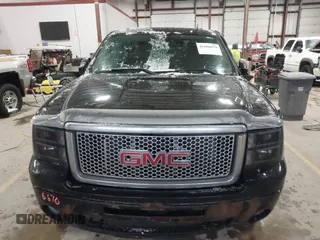 2011 GMC Sierra 1500 Denali z VIN 3GTP2XE2XBG128854, wystawiony jako IAAI lot #41606670 z przebiegiem 150 556 mil mil oraz . Historia ofert i sprzedaży dostępna na DreamBid. Obrazek 12.