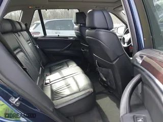 2011 BMW X5 35i with VIN 5UXZV4C56BL412415, listed as a IAAI auction lot 41611847 with 141,848 mi miles. Bid and sale history available at carsss.com. Image 8.