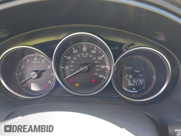 2016 Mazda CX-5 Grand Touring with VIN JM3KE2DYXG0773663, listed as a IAAI auction lot 41896367 with 86,571 mi miles and . Bid and sale history available at DreamBid. Image 7.