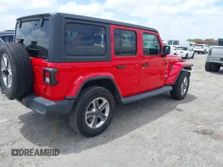 2019 Jeep Wrangler Unlimited Sahara with VIN 1C4HJXEG4KW573157, listed as a IAAI auction lot 42118373 with 105,890 mi miles and . Bid and sale history available at DreamBid. Image 4.