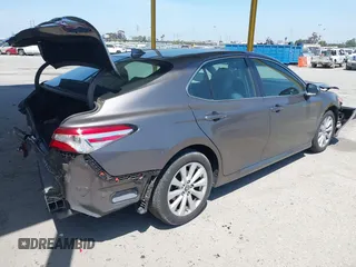 2019 Toyota Camry LE with VIN 4T1B11HK8KU204599, listed as a IAAI auction lot 42096889 with 76,518 mi miles and . Bid and sale history available at DreamBid. Image 4.