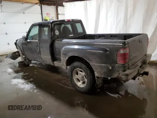 2002 Ford Ranger with VIN 1FTZR15U52PA08409, listed as a Copart auction lot 87858015 with 128,892 mi miles and Salvage Title. Bid and sale history available at DreamBid. Image 2.