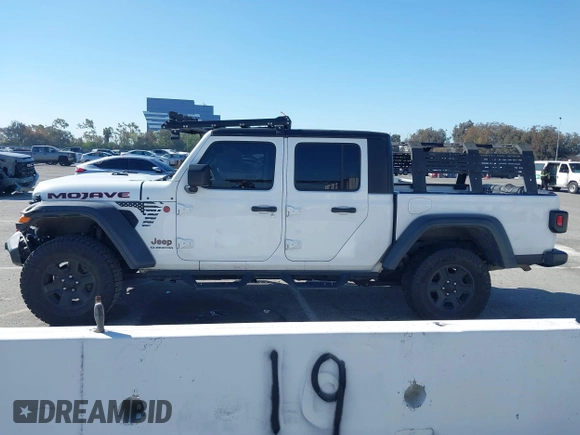 2022 Jeep Gladiator Mojave z VIN 1C6JJTEG0NL103523, wystawiony jako IAAI lot #41842011 z przebiegiem 36 160 mil mil oraz . Historia ofert i sprzedaży dostępna na DreamBid. Obrazek 15.