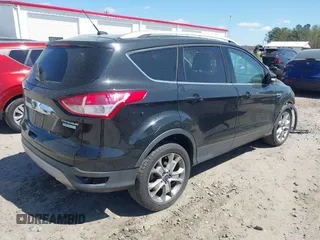 2015 Ford Escape Titanium with VIN 1FMCU0J91FUB36973, listed as a IAAI auction lot 41889560 with 93,445 mi miles and . Bid and sale history available at DreamBid. Image 4.