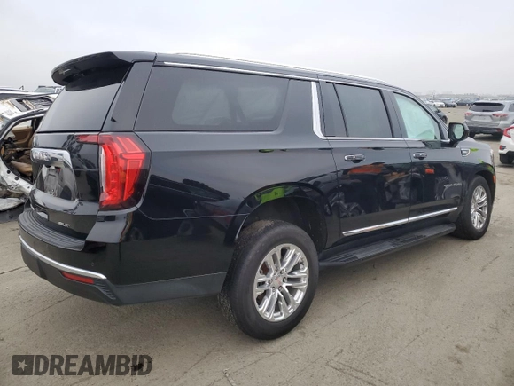 2023 GMC Yukon XL SLT with VIN 1GKS2GKD5PR363433, listed as a Copart auction lot 85979734 with 61,957 mi miles and Salvage Title. Bid and sale history available at DreamBid. Image 3.