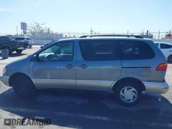 1999 Toyota Sienna LE with VIN 4T3ZF13C5XU099020, listed as a IAAI auction lot 41709287 with 206,884 mi miles. Bid and sale history available at carsss.com. Image 14.