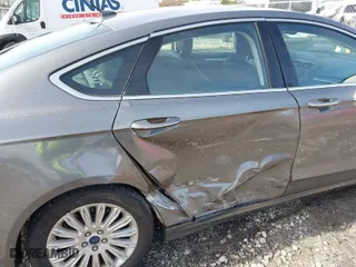 2014 Ford Fusion Energi Titanium with VIN 3FA6P0SUXER216960, listed as a IAAI auction lot 41339413 with 85,025 mi miles. Bid and sale history available at carsss.com. Image 6.