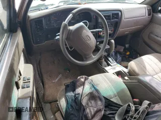 1999 Toyota Tacoma with VIN 4TAWN72NXXZ563507, listed as a Copart auction lot 49888575 with 387,818 mi miles and Salvage title. Bid and sale history available at DreamBid. Image 8.