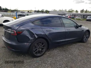 2023 Tesla Model 3 with VIN 5YJ3E1EA7PF395196, listed as a Copart auction lot 51260465 with 41,119 mi miles and Salvage title. Bid and sale history available at DreamBid. Image 3.