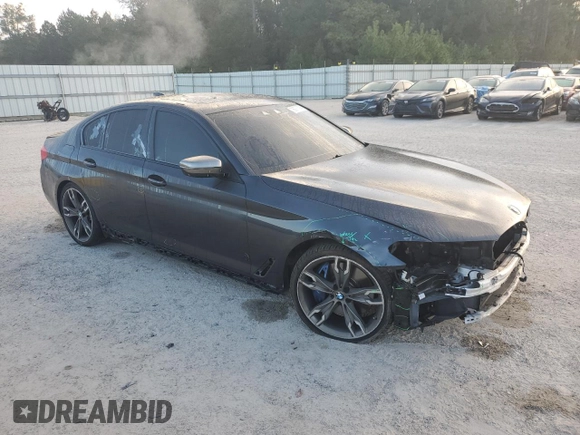 2019 BMW 5 Series M550i xDrive with VIN WBAJB9C57KB288906, listed as a Copart auction lot 79846274 with 61,744 mi miles and Salvage title. Bid and sale history available at DreamBid. Image 4.