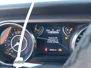 2023 Jeep Gladiator Sport S z VIN 1C6HJTAG8PL528821, wystawiony jako IAAI lot #41777653 z przebiegiem 65 656 mil mil oraz . Historia ofert i sprzedaży dostępna na DreamBid. Obrazek 7.