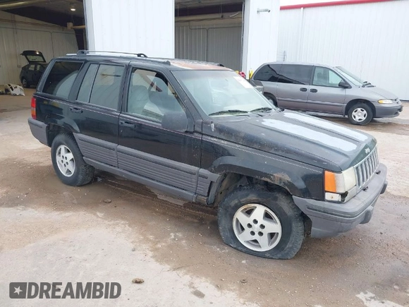 1994 Jeep Grand Cherokee Laredo with VIN 1J4GZ58S2RC118838, listed as a IAAI auction lot 42047224 with 160,715 mi miles. Bid and sale history available at carsss.com. Image 1.