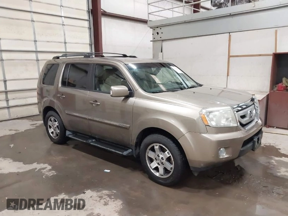 2011 Honda Pilot Touring with VIN 5FNYF4H92BB053458, listed as a IAAI auction lot 41594708 with 136,454 mi miles. Bid and sale history available at carsss.com. Image 1.