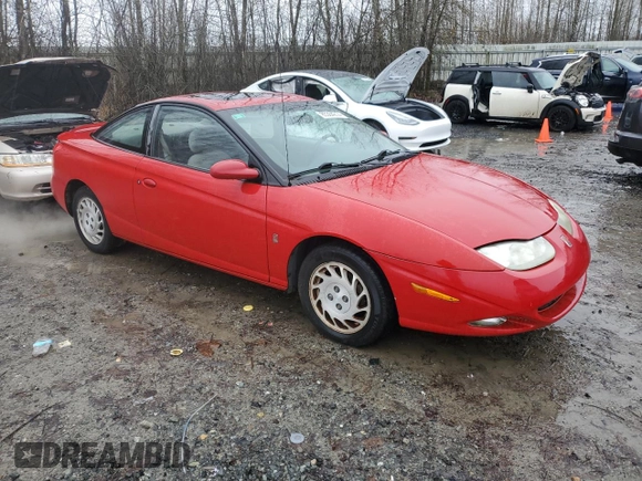 2002 Saturn SC z VIN 1G8ZY12752Z308435, wystawiony jako Copart lot #85364214 z przebiegiem 112 649 mil mil oraz Tytuł czysty. Historia ofert i sprzedaży dostępna na DreamBid. Obrazek 4.