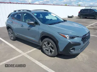 2024 Subaru Crosstrek Premium z VIN JF2GUADC6R8306021, wystawiony jako IAAI lot #42078539 z przebiegiem 28 497 mil mil oraz . Historia ofert i sprzedaży dostępna na DreamBid. Obrazek 1.