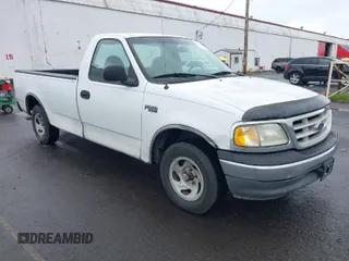 1999 Ford F-150 Work Series with VIN 1FTZF1726XNA31785, listed as a IAAI auction lot 41969897 with 313,421 mi miles. Bid and sale history available at carsss.com. Image 1.