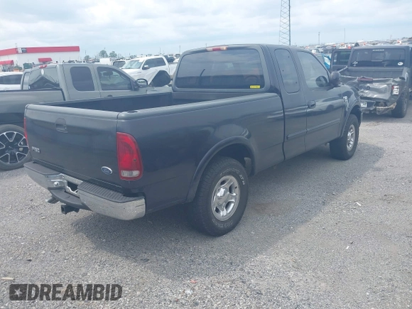 1999 Ford F-150 XL with VIN 1FTRX18L3XNA05021, listed as a IAAI auction lot 42138727 with 1 mi miles. Bid and sale history available at carsss.com. Image 4.