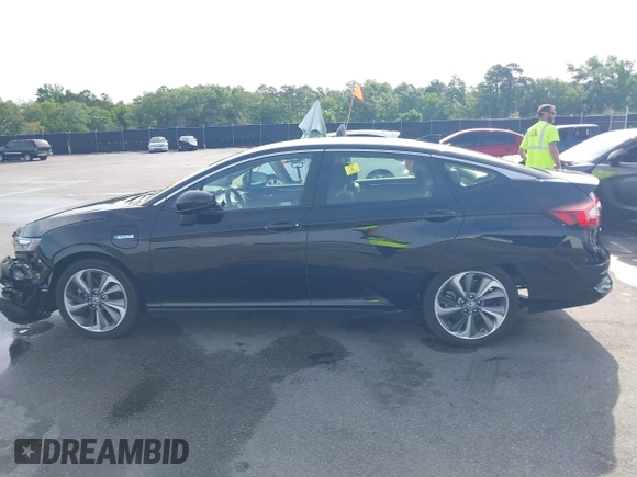 2021 Honda Clarity Touring z VIN JHMZC5F3XMC001253, wystawiony jako IAAI lot #42212102 z przebiegiem 35 649 mil mil oraz . Historia ofert i sprzedaży dostępna na DreamBid. Obrazek 14.