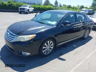 2011 Toyota Avalon with VIN 4T1BK3DB2BU404537, listed as a IAAI auction lot 41989468 with 180,403 mi miles and . Bid and sale history available at carsss.com. Image 2.