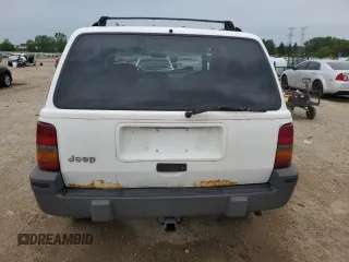 1995 Jeep Grand Cherokee Laredo z VIN 1J4GZ58S2SC578183, wystawiony jako Copart lot #61665955 z przebiegiem 341 135 mil mil oraz Szkoda całkowita • Salvage title. Historia ofert i sprzedaży dostępna na DreamBid. Obrazek 6.