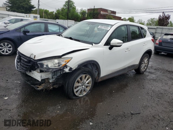 2016 Mazda CX-5 Sport z VIN JM3KE4BY2G0802376, wystawiony jako Copart lot #55976585 z przebiegiem 112 600 mil mil oraz Szkoda całkowita • Salvage title. Historia ofert i sprzedaży dostępna na DreamBid. Obrazek 1.