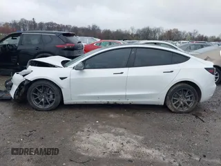 2022 Tesla Model 3 Long Range with VIN 5YJ3E1EB0NF129945, listed as a IAAI auction lot 41965531 with 59,162 mi miles and . Bid and sale history available at DreamBid. Image 14.