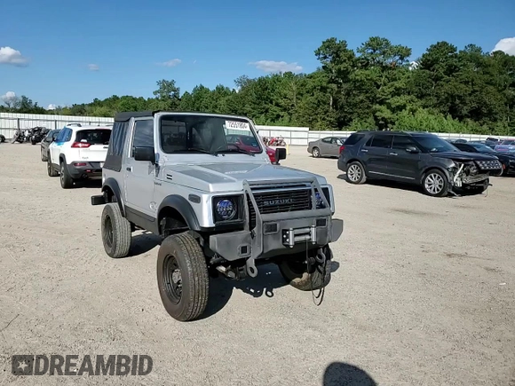 1987 Suzuki Samurai z VIN JS3JC51C3H4186141, wystawiony jako Copart lot #72551804 z przebiegiem 525 030 mil mil oraz Szkoda całkowita • Salvage title. Historia ofert i sprzedaży dostępna na DreamBid. Obrazek 11.