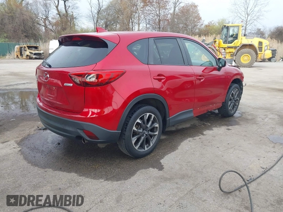 2016 Mazda CX-5 Grand Touring with VIN JM3KE4DY9G0865780, listed as a IAAI auction lot 41913914 with 76,579 mi miles. Bid and sale history available at carsss.com. Image 4.